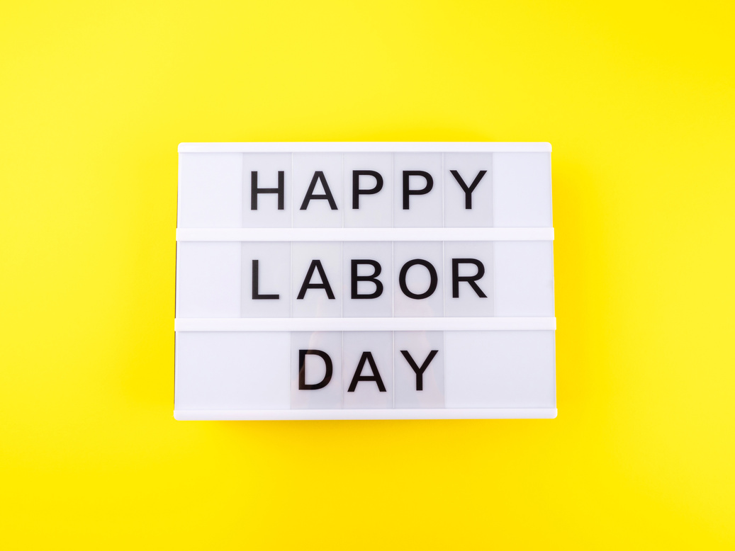 Happy Labor Day greetings on white lightbox on yellow background
